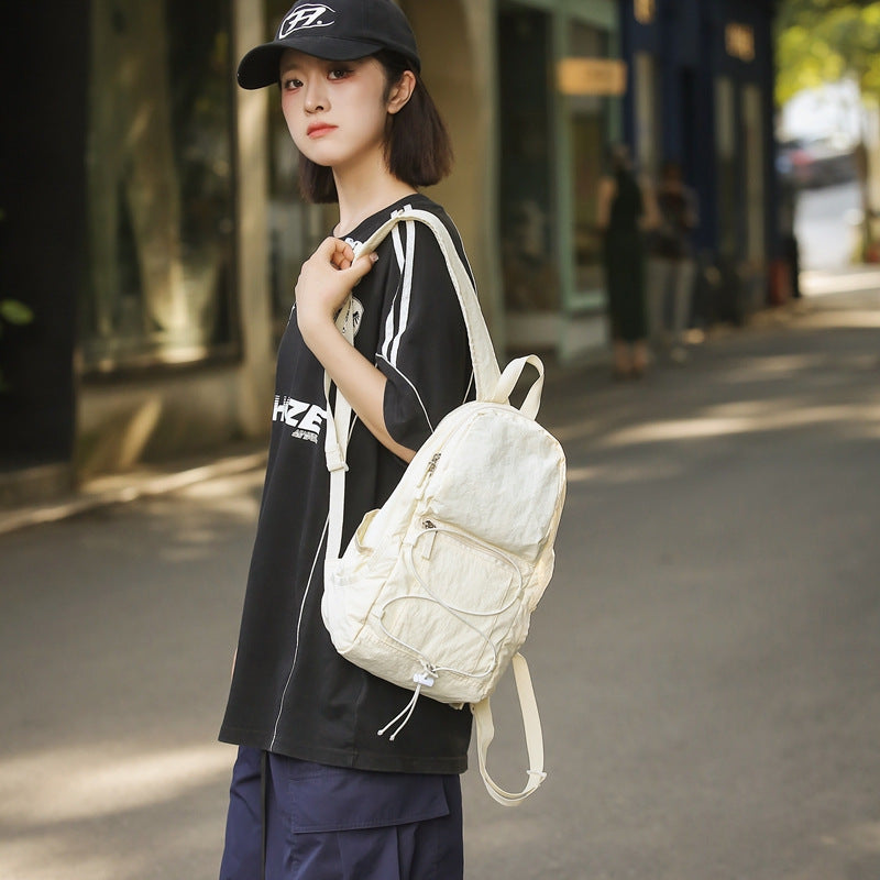 Outdoor casual backpack 2025 new cross strap niche high value backpack couple going out travel bag tide