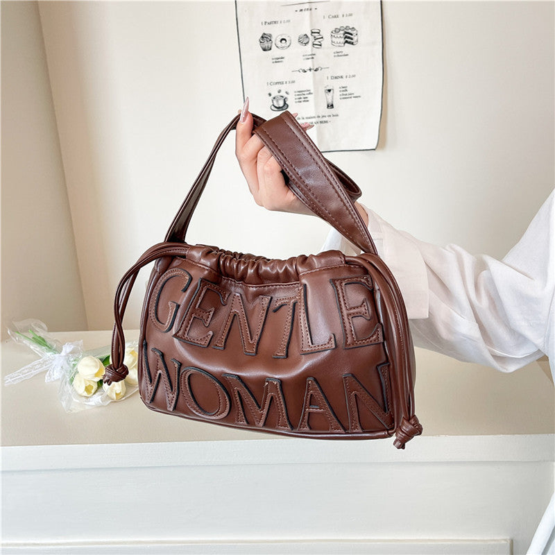 Thailand gentle woman drawstring bag women's 2026 new embossed letter shoulder bag trendy tote bag