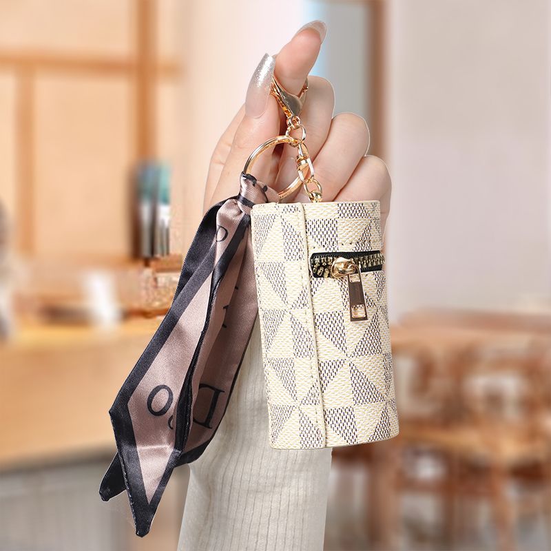 European and American old flower change bag 2024 new compact bag pendant earphone bag mouth red envelope mini keychain bag