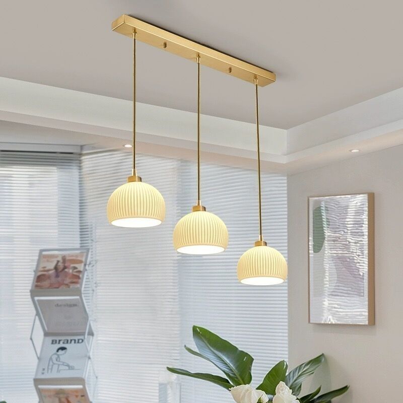 Modern minimalist dining room pendant light - creamy new style  - trending online - perfect for dining tables, bedrooms, studies, and bar counters - glass pendant lamp