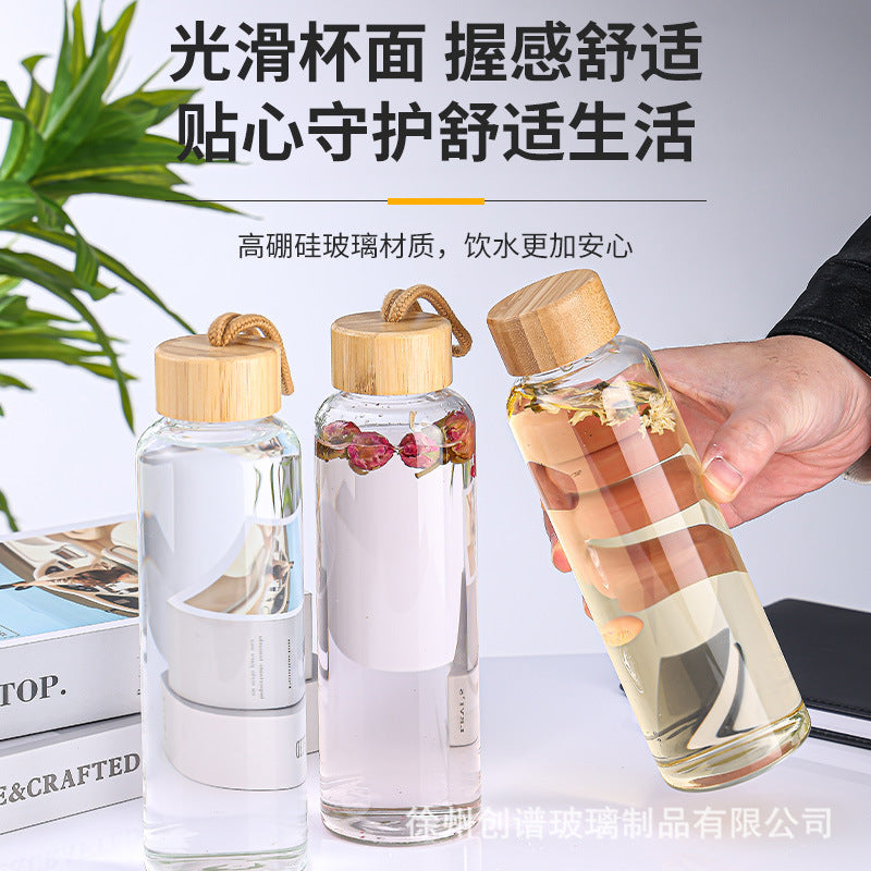 Cross-border 16oz bamboo cover with lifting rope heat-resistant silicone sleeve transparent single-layer borosilicate glass water cup printing logo