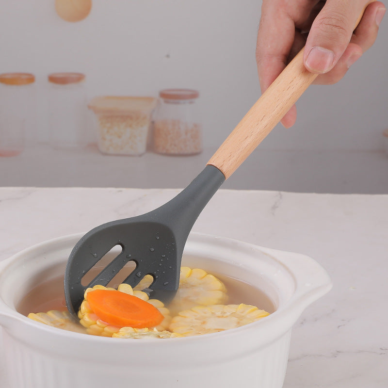 Food grade silicone non-stick pan is denser and more leak-resistant to high temperature. Household wooden handle, dense spoon, colander, kitchen cooking tools