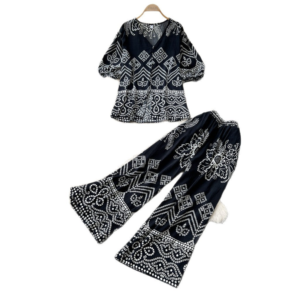 Vacation-ready green floral print two-piece set for women. summer v-neck, slimming wide-leg pants, perfect for both work and play. a stylish and chic outfit