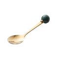 Dark green spoon