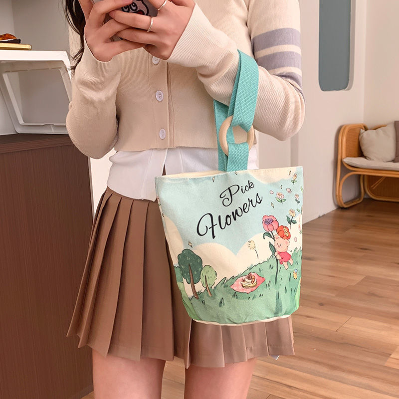 Cute cartoon canvas tote bag for women, 2024 new style handheld bucket bag, large capacity lunch bag, fashionable cloth handbag