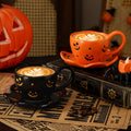 Creative halloween-themed ceramic cup and saucer set, featuring an irregular design with pumpkin and bat motifs. perfect for coffee or tea