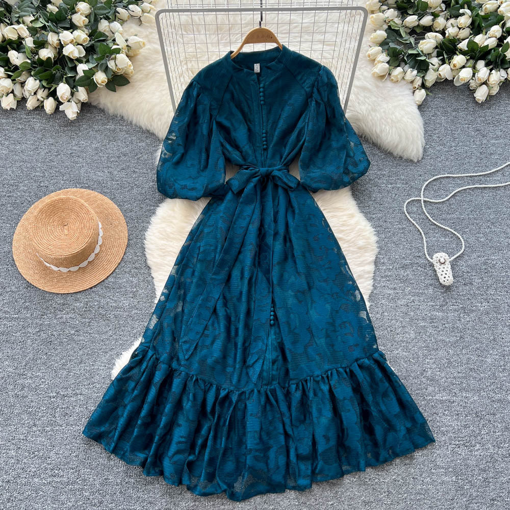 French-inspired v-neck floral chiffon dress with flared sleeves, tie waist, and a figure-flattering, vintage-inspired silhouette
