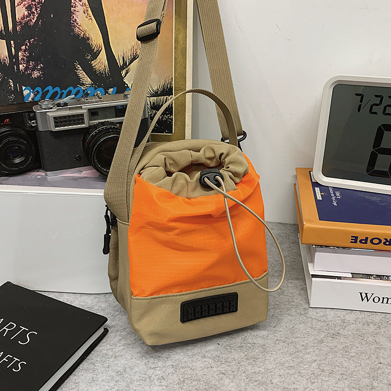 Foreign trade cute contrasting color draw belt small bag women 2025 new versatile sports and leisure shoulder messenger bag cloth bag