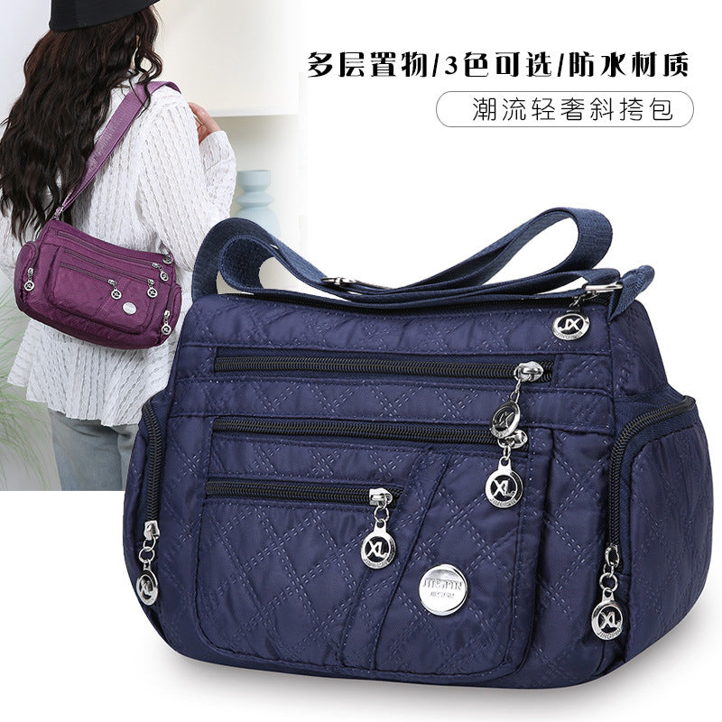 Outdoor casual versatile messenger bag women's large-capacity rhombus embroidery thread simple shoulder bag three-layer storage middle-aged women's bag