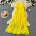 Vacation-ready yellow tube top sexy dress for women, featuring a ruffled halter neck design, a unique and stylish french-inspired long dress perfect for summer