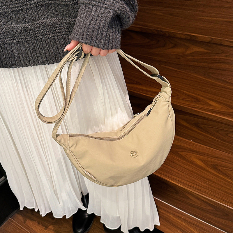 Spring casual macaron color dumpling bag 2026 new versatile crossbody bag women's korean style commuter shoulder bag