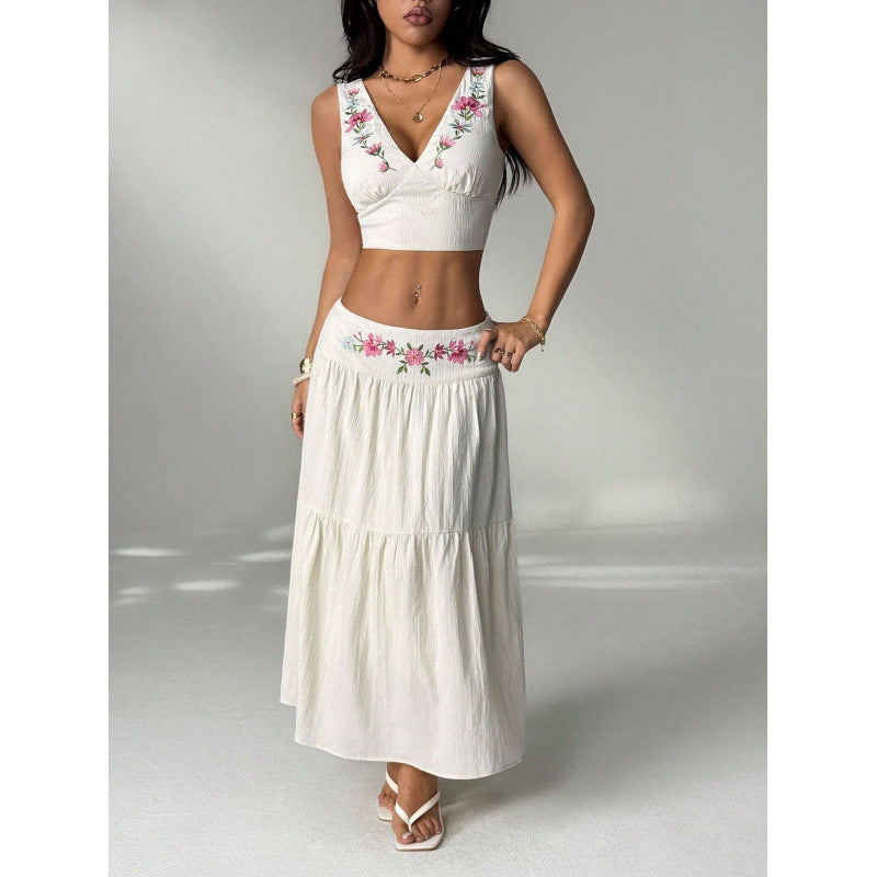 Women's embroidered v-neck sleeveless top and high-waisted a-line maxi skirt two-piece set, perfect for a stylish vacation look