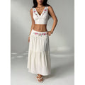Women's embroidered v-neck sleeveless top and high-waisted a-line maxi skirt two-piece set, perfect for a stylish vacation look