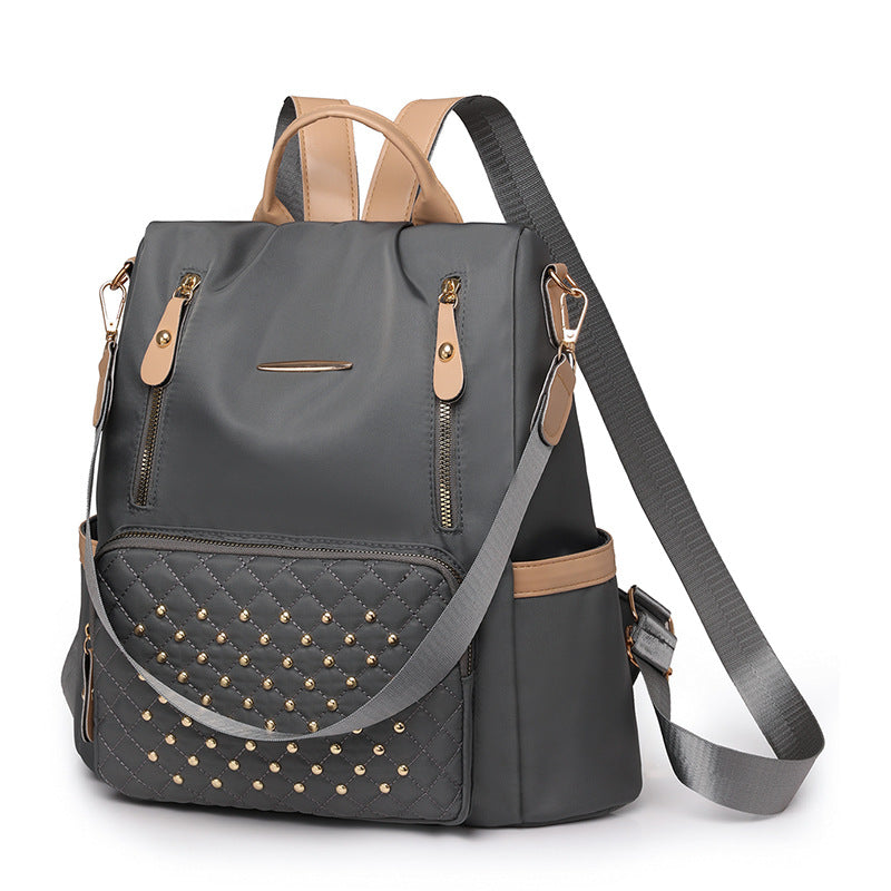 Rhombus student schoolbag large capacity fashion simple casual versatile backpack rivet inlaid women's backpack wholesale