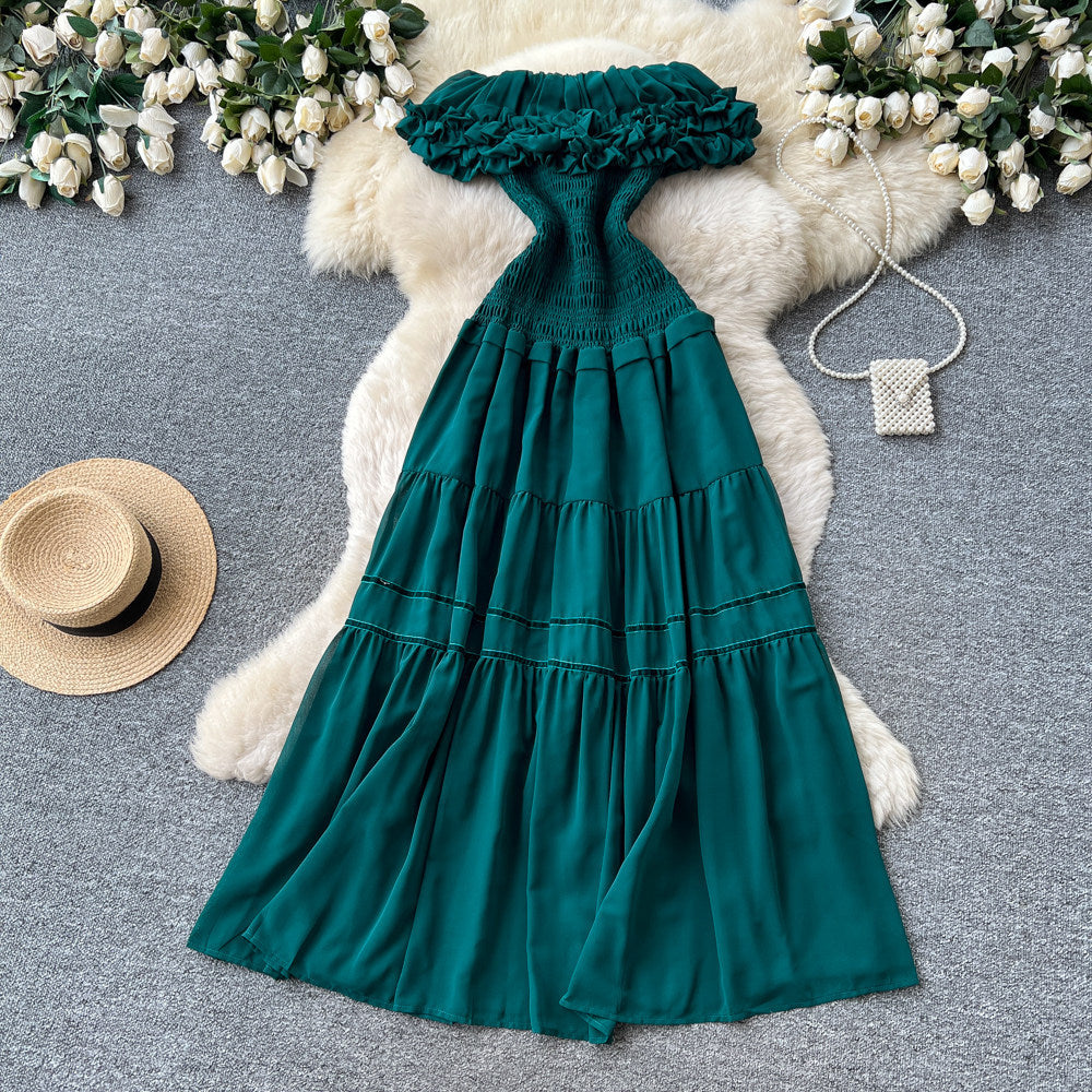 French-inspired, strapless, and stylish dress for women. high-waisted, slimming, and featuring a flattering ruffle hem. perfect for summer, this long, flowing dress comes in a chic green