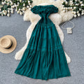 French-inspired, strapless, and stylish dress for women. high-waisted, slimming, and featuring a flattering ruffle hem. perfect for summer, this long, flowing dress comes in a chic green