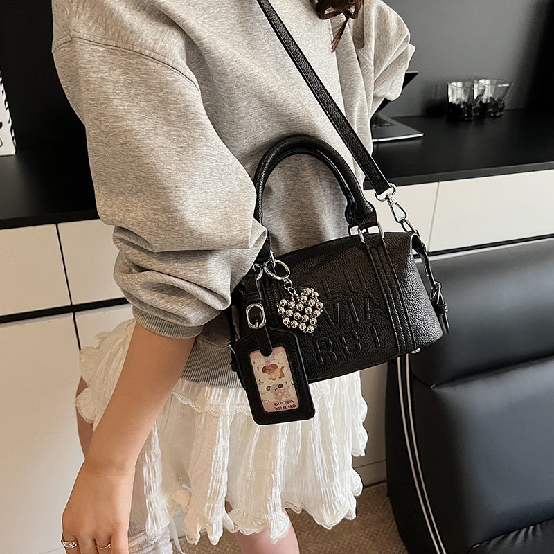 Fashion niche high-end sense embossed letter pillow bag 2025 new summer versatile color casual messenger bag