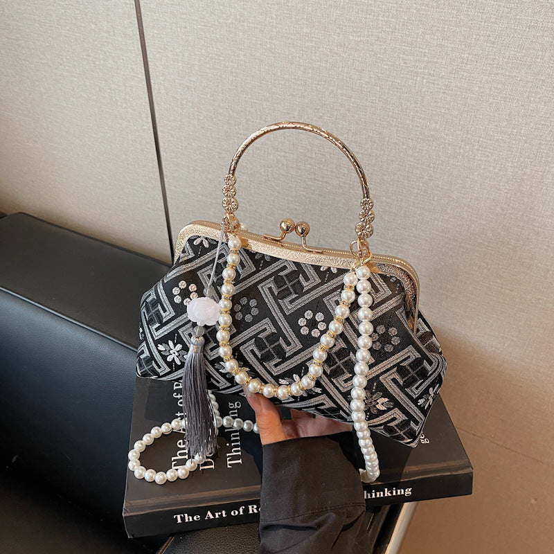 Cross-border new Chinese style national style hand bag women's summer 2025 new niche messenger bag Korean version popular mouth gold bag