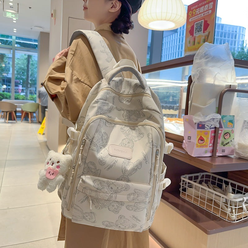 New high school and junior high school students large-capacity night reflective backpack travel backpack Japanese simple graffiti bear