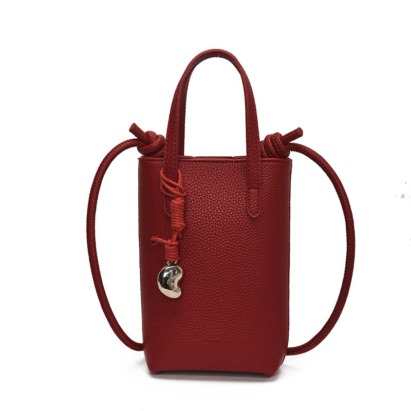 Casual simple niche portable bucket bag women's 2025 new fashion shoulder bag commuter messenger mobile phone bag