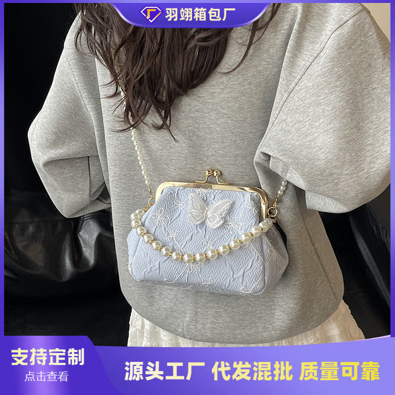 Foreign trade new Chinese embroidery small bag women's 2025 summer new fashion pearl chain mouth gold bag versatile messenger bag