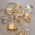 Wholesale glossy open bangle bracelets for the us and european cross-border e-commerce market. unique alloy bangles with an irregular design, perfect for women