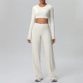 High-waisted, straight-leg, wide-leg, quick-drying yoga set with built-in bra pads, featuring a cropped, long-sleeved design. perfect for outdoor running and fitness activities for women