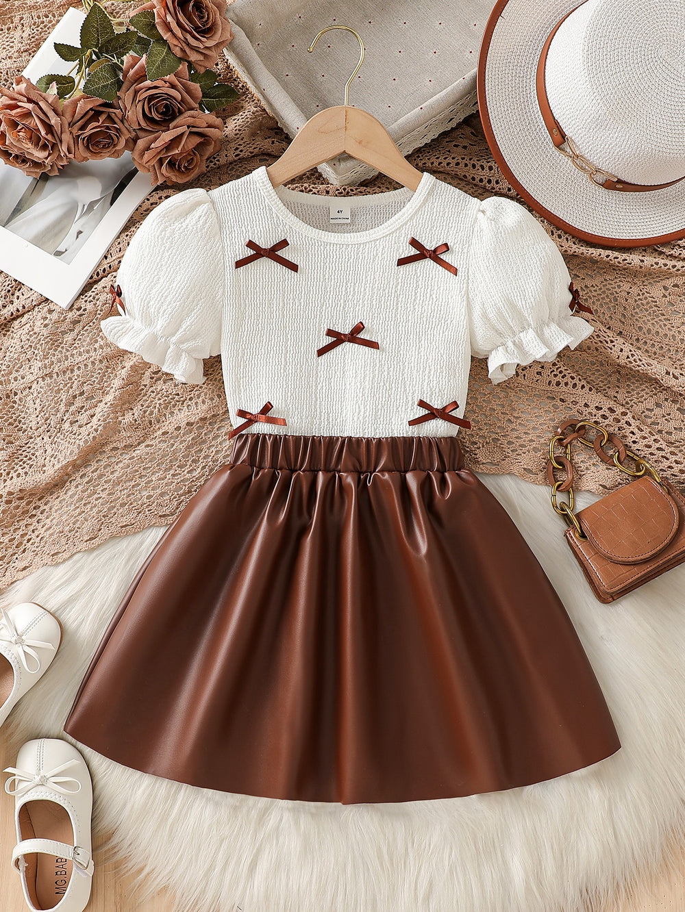 girls' autumn new arrival: bubble sleeve bow texture top + pu leather a-line skirt two-piece set