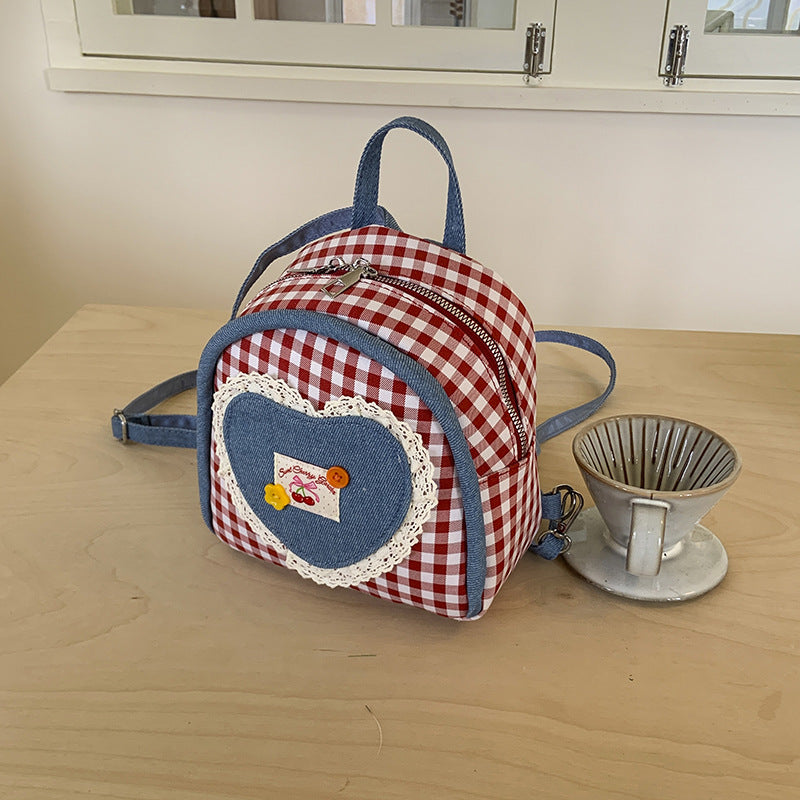 Outer order super fire plaid women's backpack 2025 new spring and summer contrasting color versatile backpack mini schoolbag