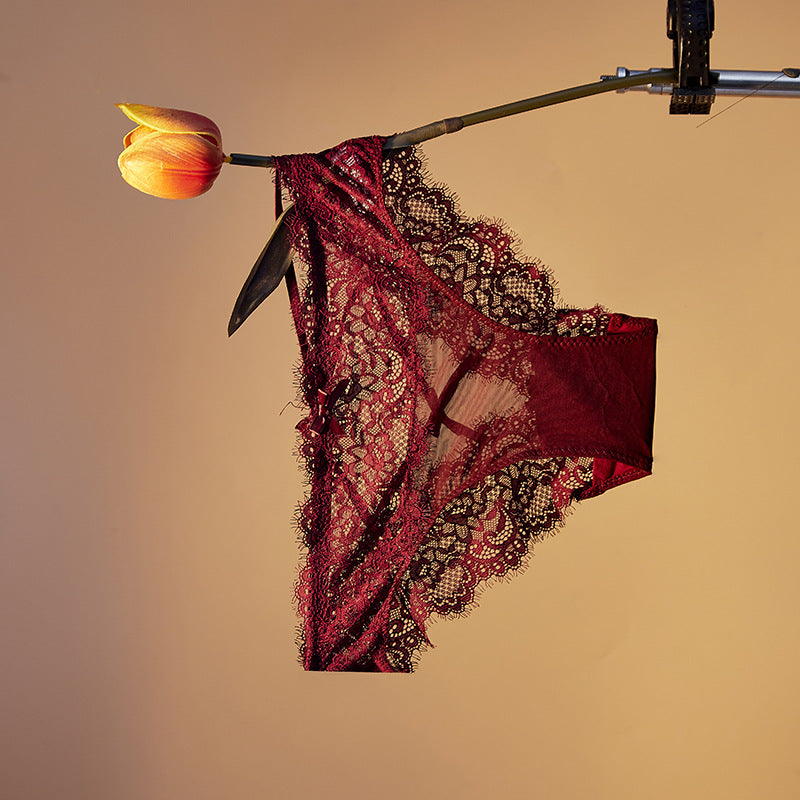 lingerie factory: low-rise, sexy women's panties featuring bow accents, lace detailing, and a breathable, criss-cross design. women's briefs