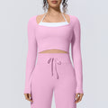 Naked-feel, form-fitting, quick-dry yoga top. faux two-piece design with built-in bra pads. long-sleeved athletic top for pilates, training, and fitness. women's