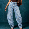 European and american style women's washed denim jeans with metal rivet embellishments, high waist, split seam detail, relaxed fit, and wide leg design
