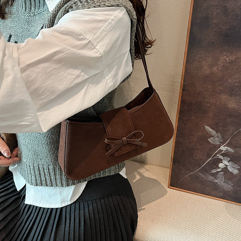 Red bag women's bag 2025 new shoulder baguette bag Korean version fashion minimalist niche bow armpit bag