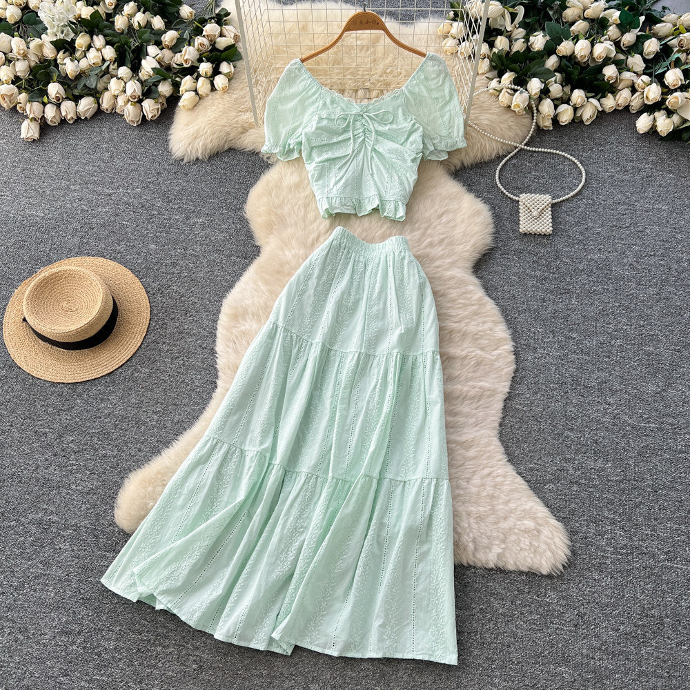 Korean-inspired, stylish and chic women's two-piece set featuring a puff-sleeve, square-neck top and a high-waisted, figure-flattering midi skirt