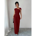 Women's elegant sleeveless fitted top with metal accents and asymmetrical hem, paired with loose straight-leg pants - 2-piece set
