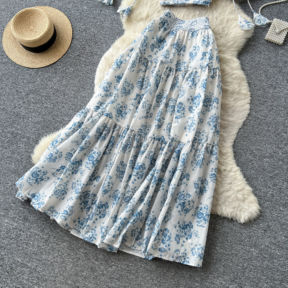 Vacation-ready blue floral two-piece set: women's summer high-waisted maxi skirt outfit - perfect for a garden getaway