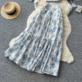 Vacation-ready blue floral two-piece set: women's summer high-waisted maxi skirt outfit - perfect for a garden getaway