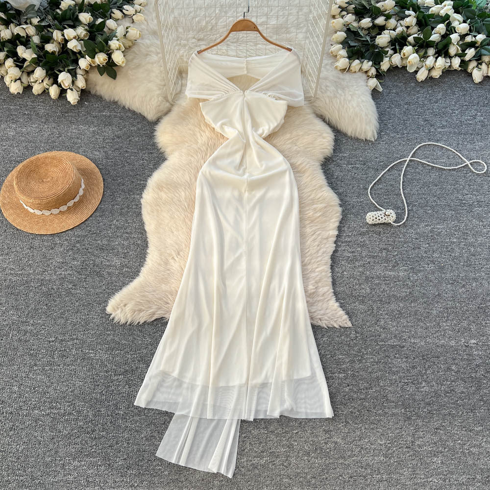 Luxury chic women's french-style one-shoulder bandeau dress with metal buckle, cinched waist, and flowing ribbon mesh detail