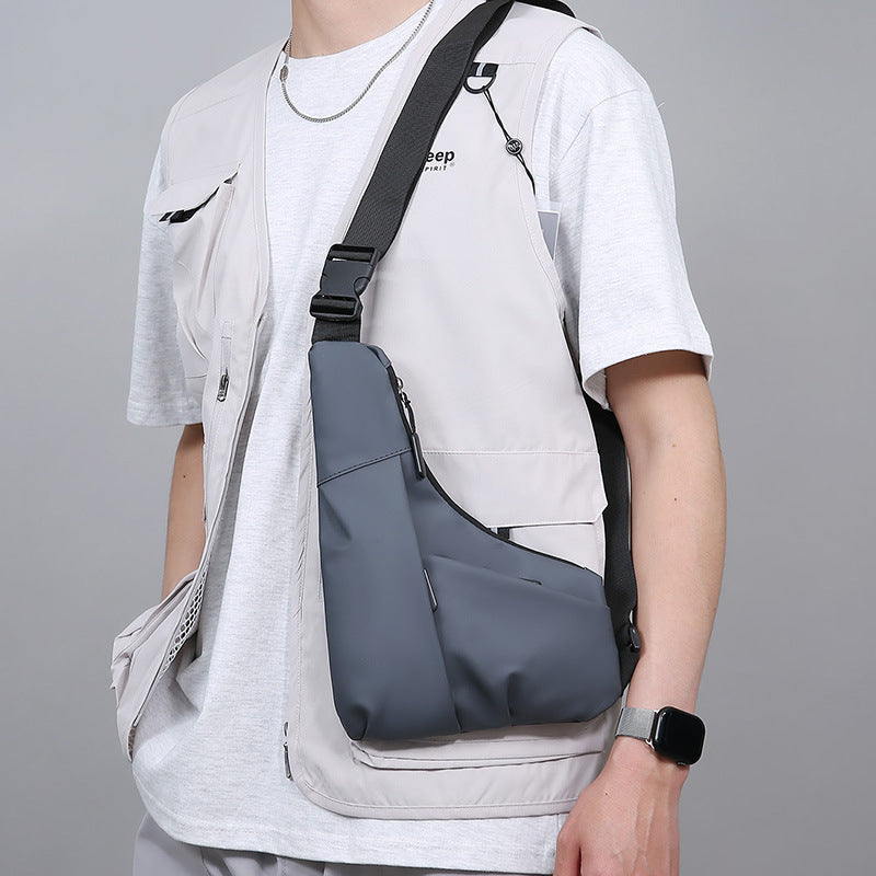 New men's light and close-fitting triangular bag, simple leather film texture shoulder messenger bag, trendy and cool casual portable breast bag