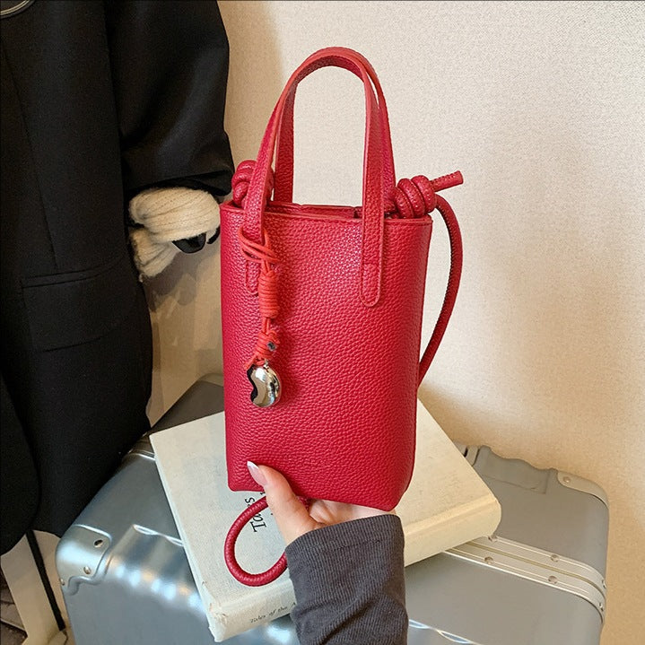 Casual simple niche portable bucket bag women's 2025 new fashion shoulder bag commuter messenger mobile phone bag