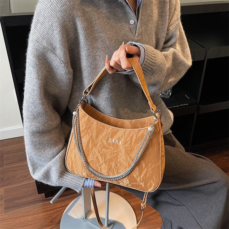 High-end women's bag, large capacity, 2025 new style, niche design, shoulder bag, crossbody bag, understated luxury, textured, commuter tote bag