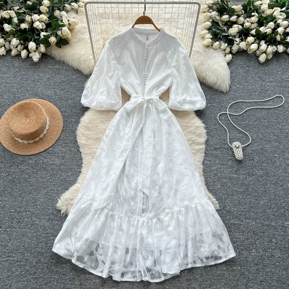 French-inspired v-neck floral chiffon dress with flared sleeves, tie waist, and a figure-flattering, vintage-inspired silhouette