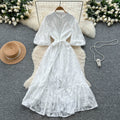 French-inspired v-neck floral chiffon dress with flared sleeves, tie waist, and a figure-flattering, vintage-inspired silhouette