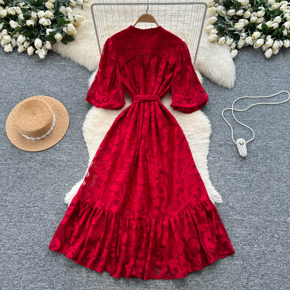 French-inspired v-neck floral chiffon dress with flared sleeves, tie waist, and a figure-flattering, vintage-inspired silhouette