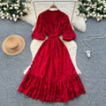 French-inspired v-neck floral chiffon dress with flared sleeves, tie waist, and a figure-flattering, vintage-inspired silhouette