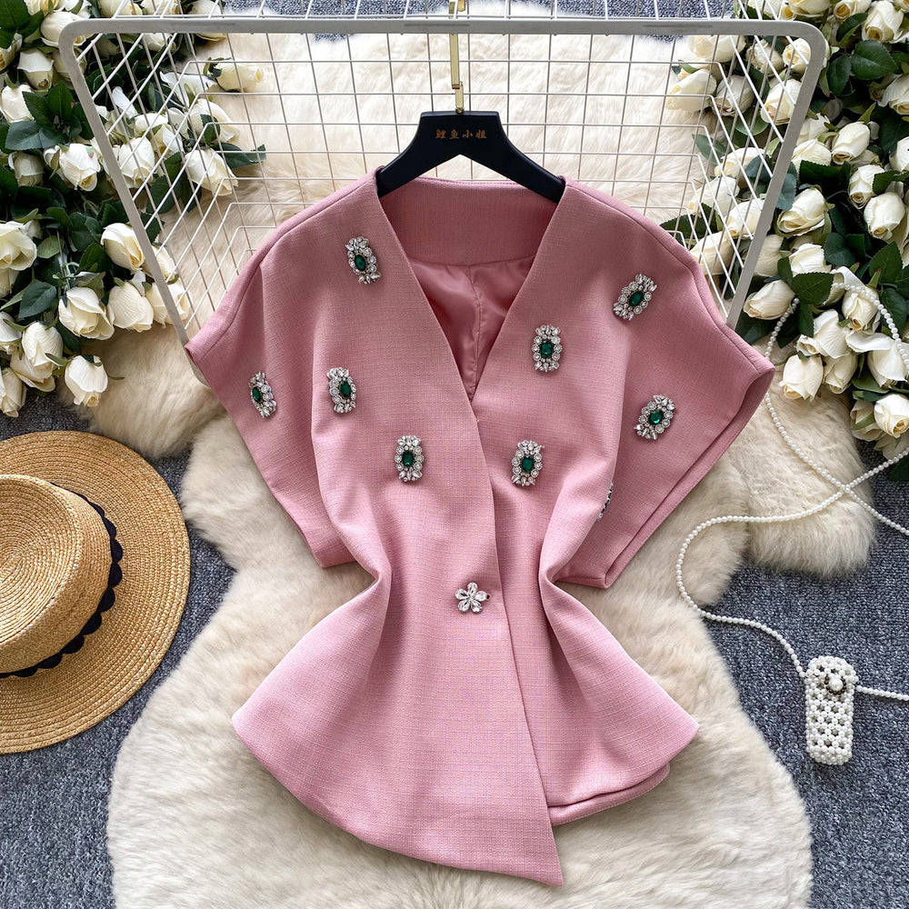 Elegant chanel-inspired, high-end, meticulously crafted, diamond-studded v-neck, short-sleeved, waist-cinching jacket for women. a chic and sophisticated french-style blazer vest, perfect for winter