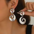 Wholesale spiral earrings: european and american style, unique, statement-making, high-end women's earrings, irregular geometric texture, gold stud earrings