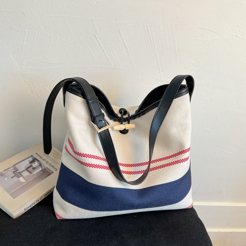 Cross-border striped canvas bag women's large capacity 2025 new summer versatile shoulder messenger bag college student tote bag