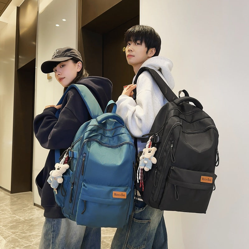 New high school students reduce the burden of backpacks, large-capacity student schoolbags, women's leisure travel, mountaineering backpacks, men's