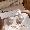 French style large pearl earrings - niche, vintage-inspired, light luxury design. high-end ear hooks, minimalist, elegant, and versatile fashion earrings